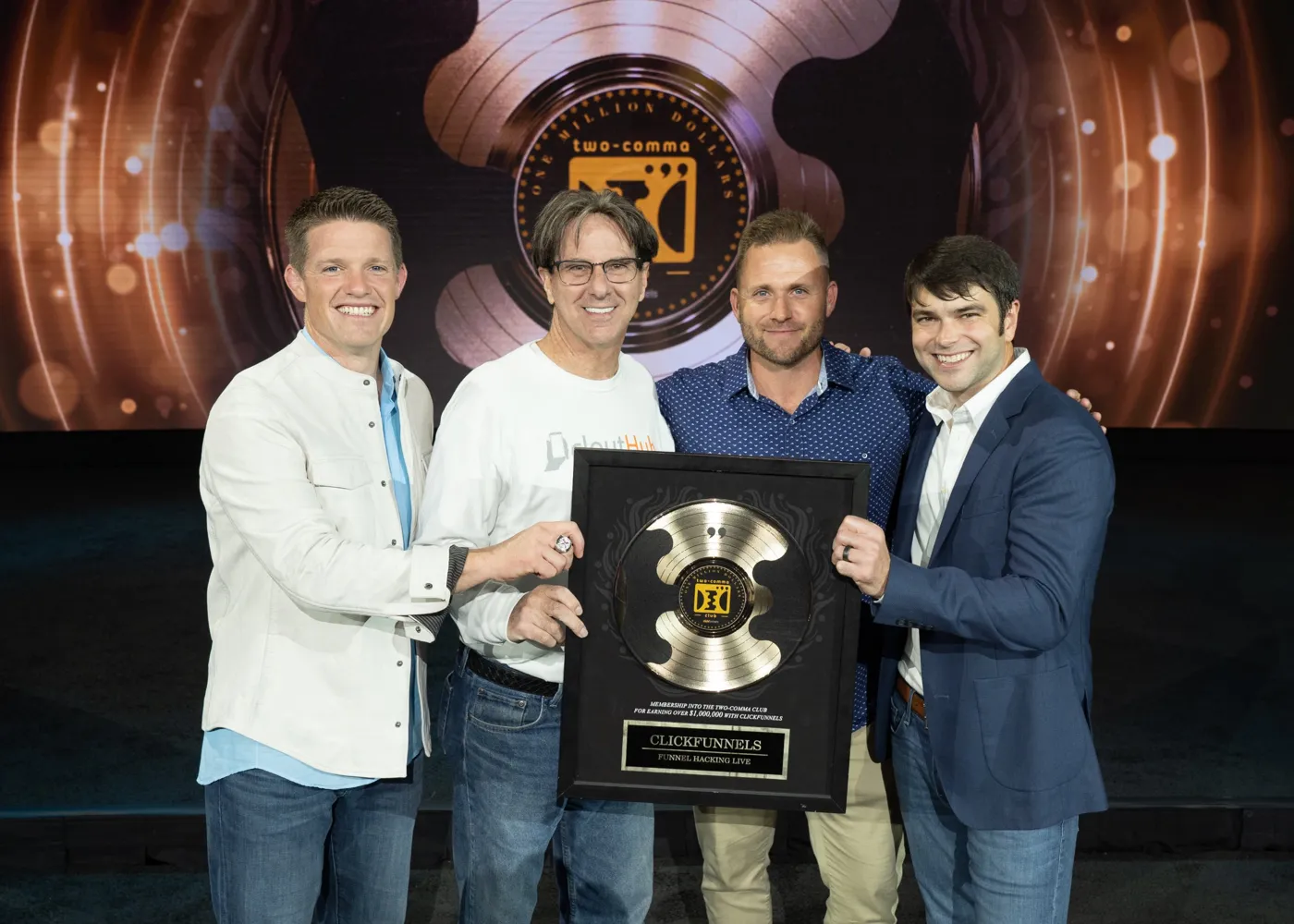 Bryan Dulaney with the CloutHub team receiving a Two Comma Club award